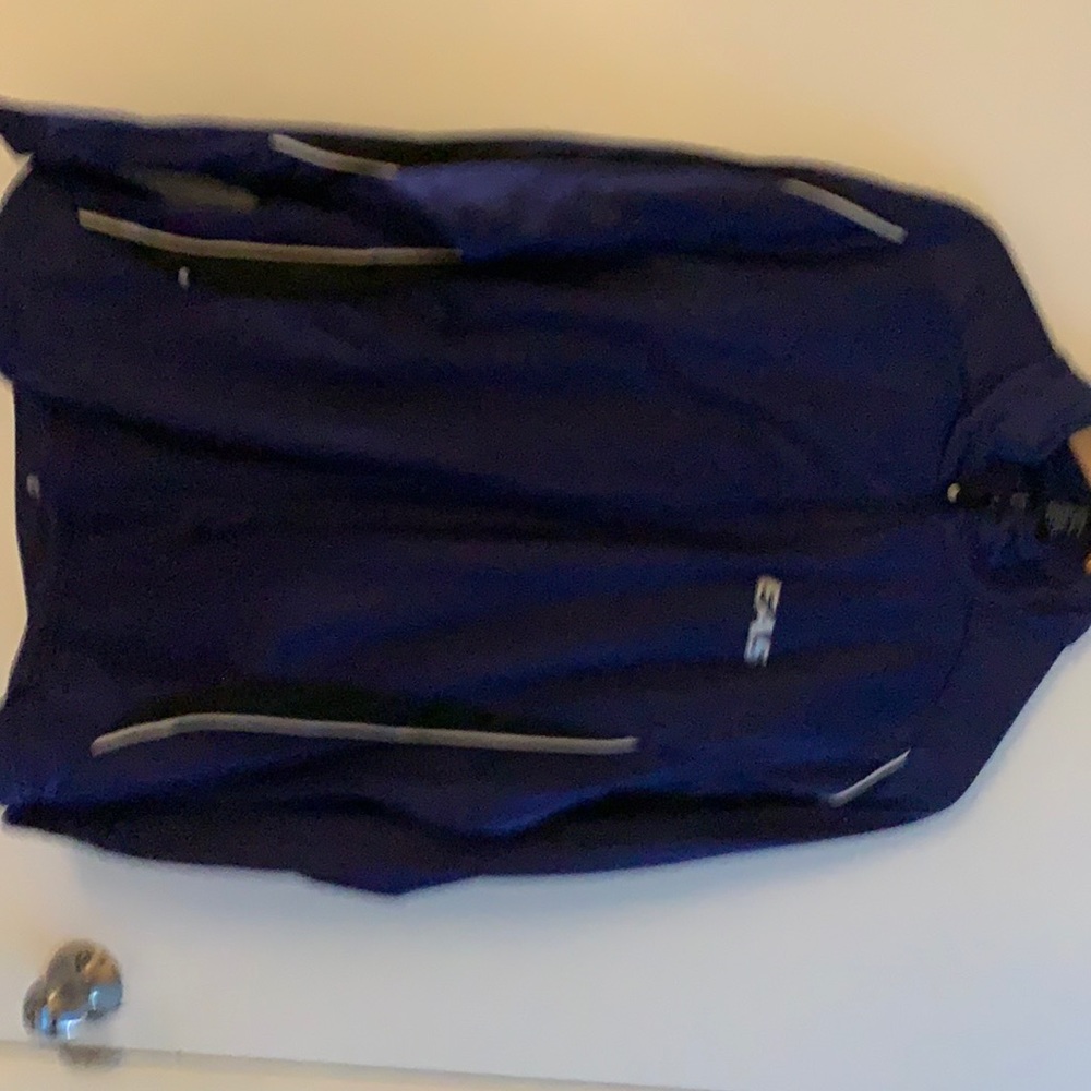 Img a purple jump suit